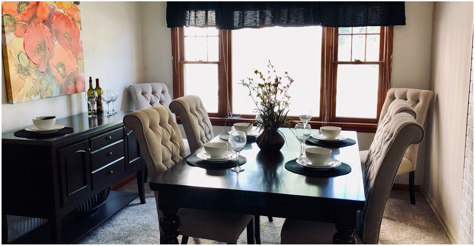 Vacant staging, Brookshire new build: dining room staged with tufted chairs and a full place setting